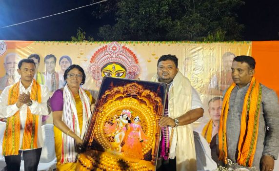 Tripura BJP president Abhishek Debroy attends cloth distribution prog in Badharghat, MLA Mina Rani Sarkar also looks on.